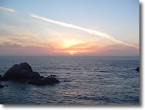 A photograph of the sun setting over the Pacific ocean, taken from the Cliff House in San Francisco, California.  Image copyright © Philip W. Tyo 2007
