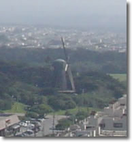 A photograph of the restored Dutch Windmill that was originally built in 1902, and is now a historic landmark. Taken from Sutro Heights Park in San Francisco, California.  Image copyright © Philip W. Tyo 2007